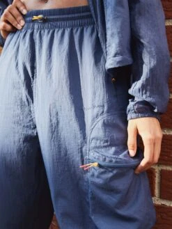 Windbreaker Pant -Outdoor Voices Shop editorial W501574 RSN DSY pant close up lead Cge5hrY